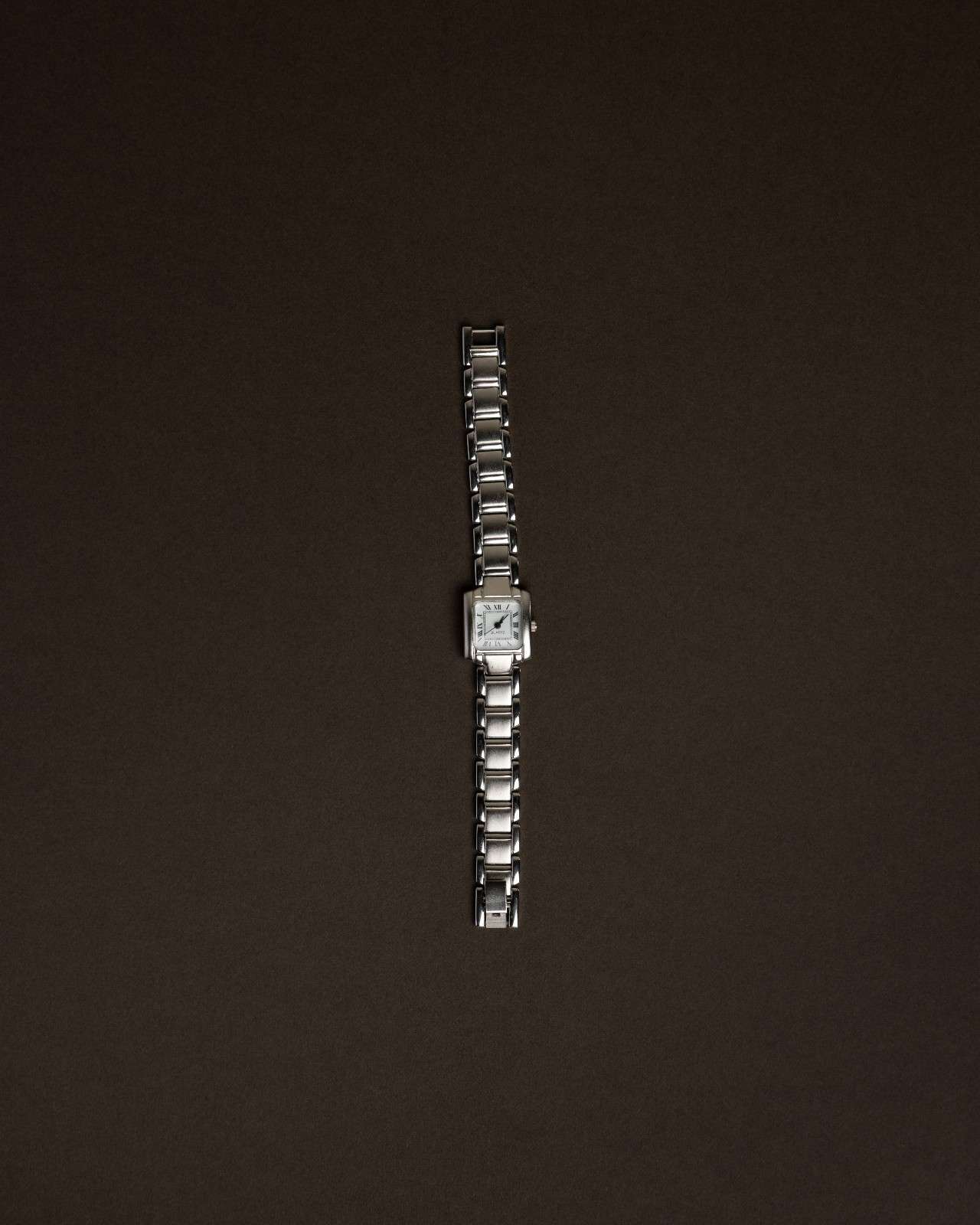 Silver Roman Dial Tank Watch