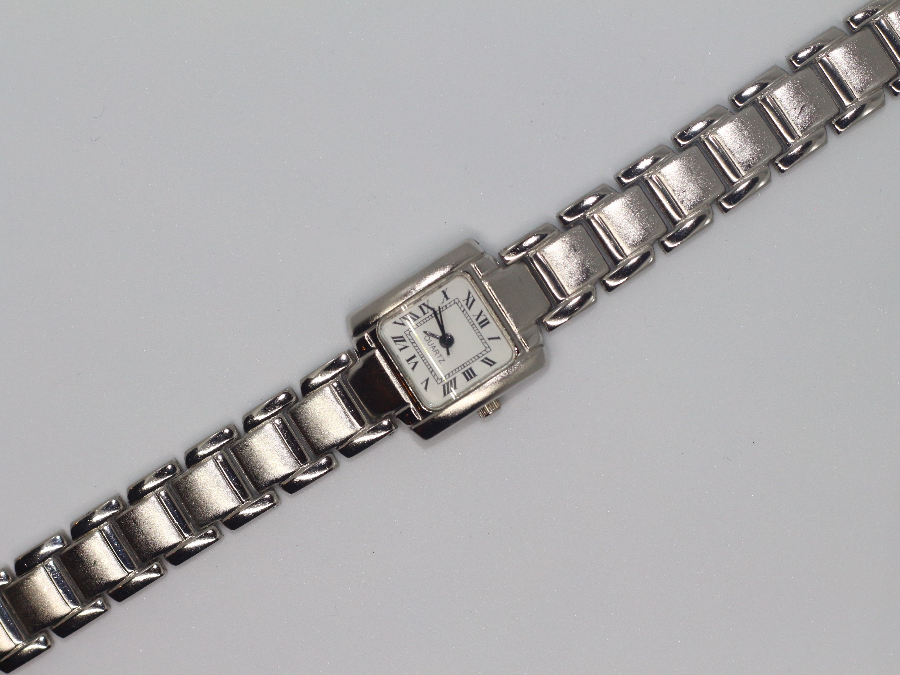 Silver Roman Dial Tank Watch